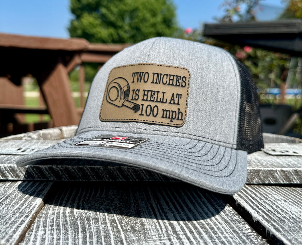 Two inches is hell at 100 MPH hat