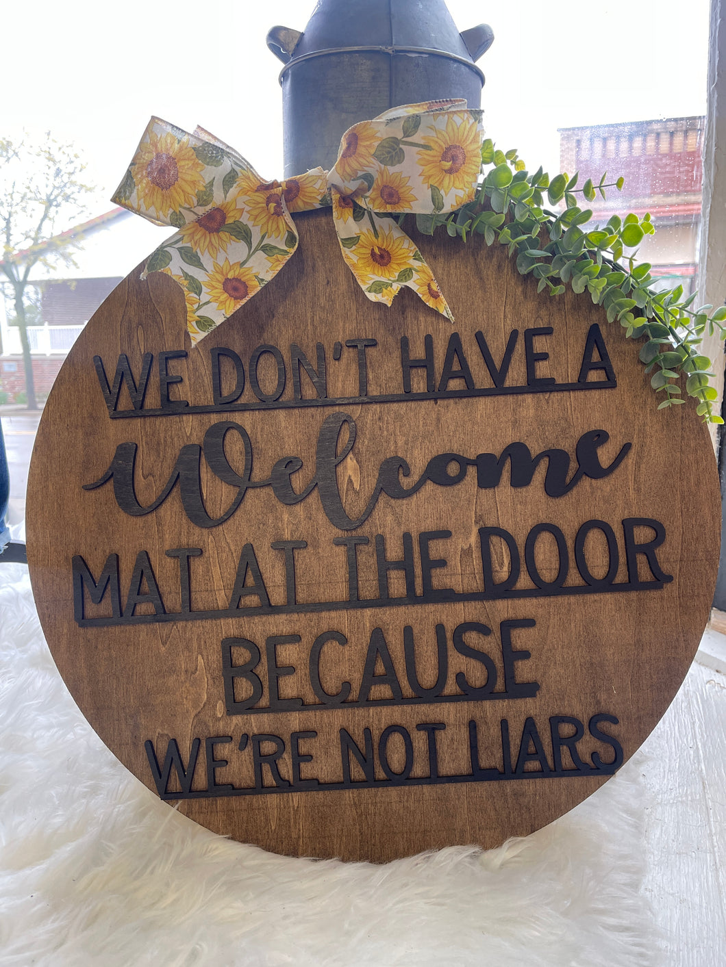 We don’t have a welcome mat at the door bc we’re not liars door hanger